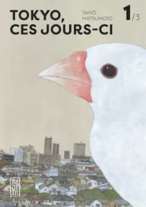 Couverture du tome 1 de Tokyo ces jours ci
Un moineau de Java, blanc au bec rouge, se détache sur la couverture, derrière lui, on distingue la ville